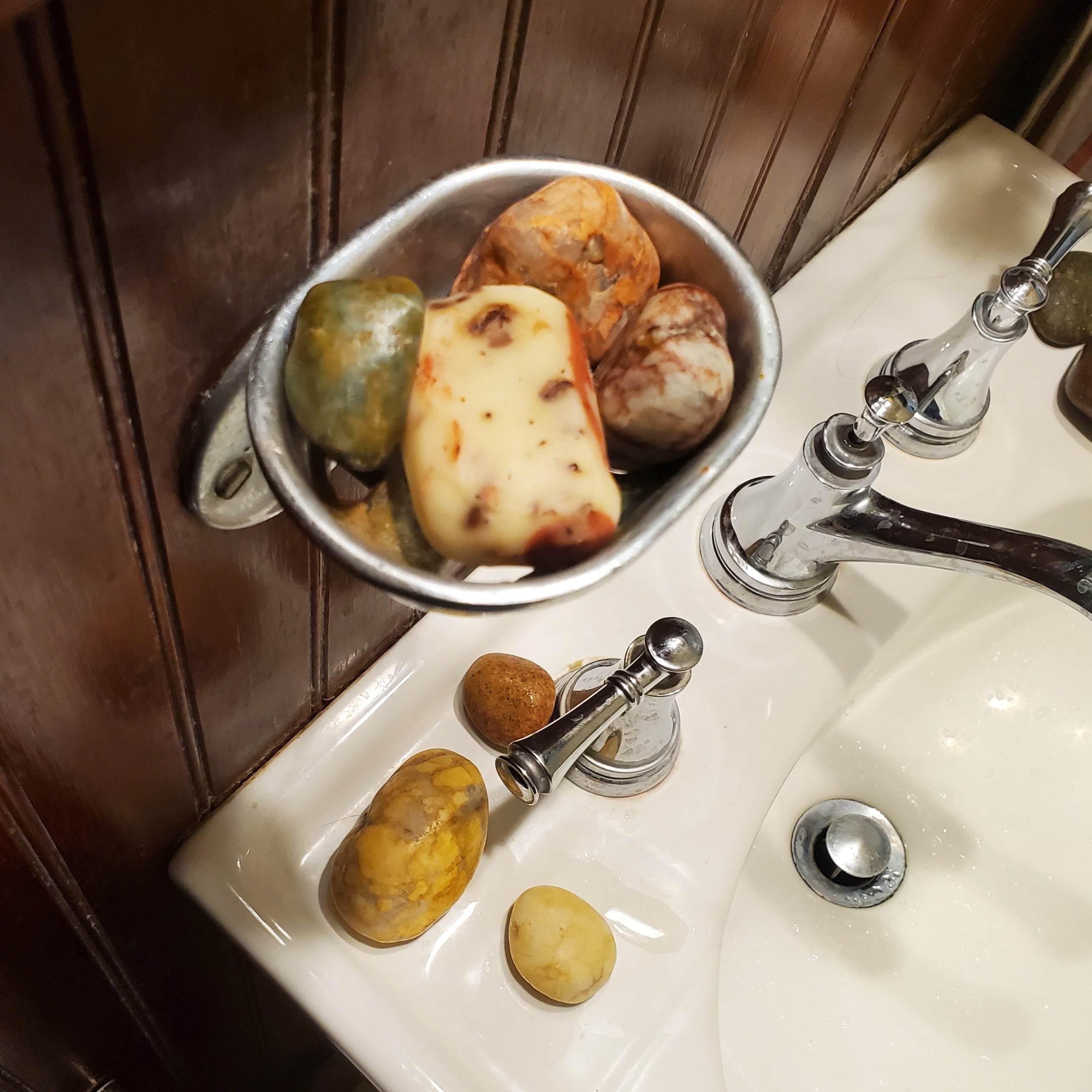 multicolored rocks among Spinster Sisters soaps above Amy Aquino's sink