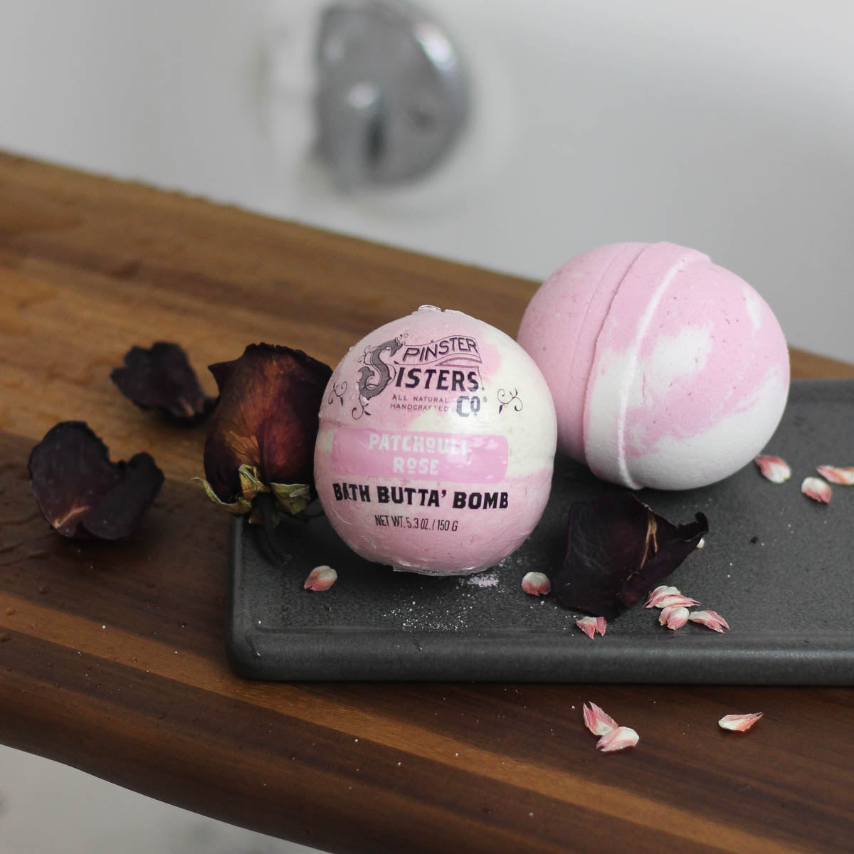 Patchouli Rose bath bombs on a bath tray