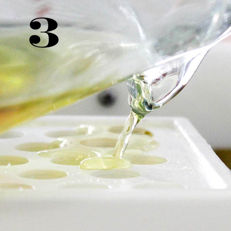 liquid being poured into a mold of lip balms