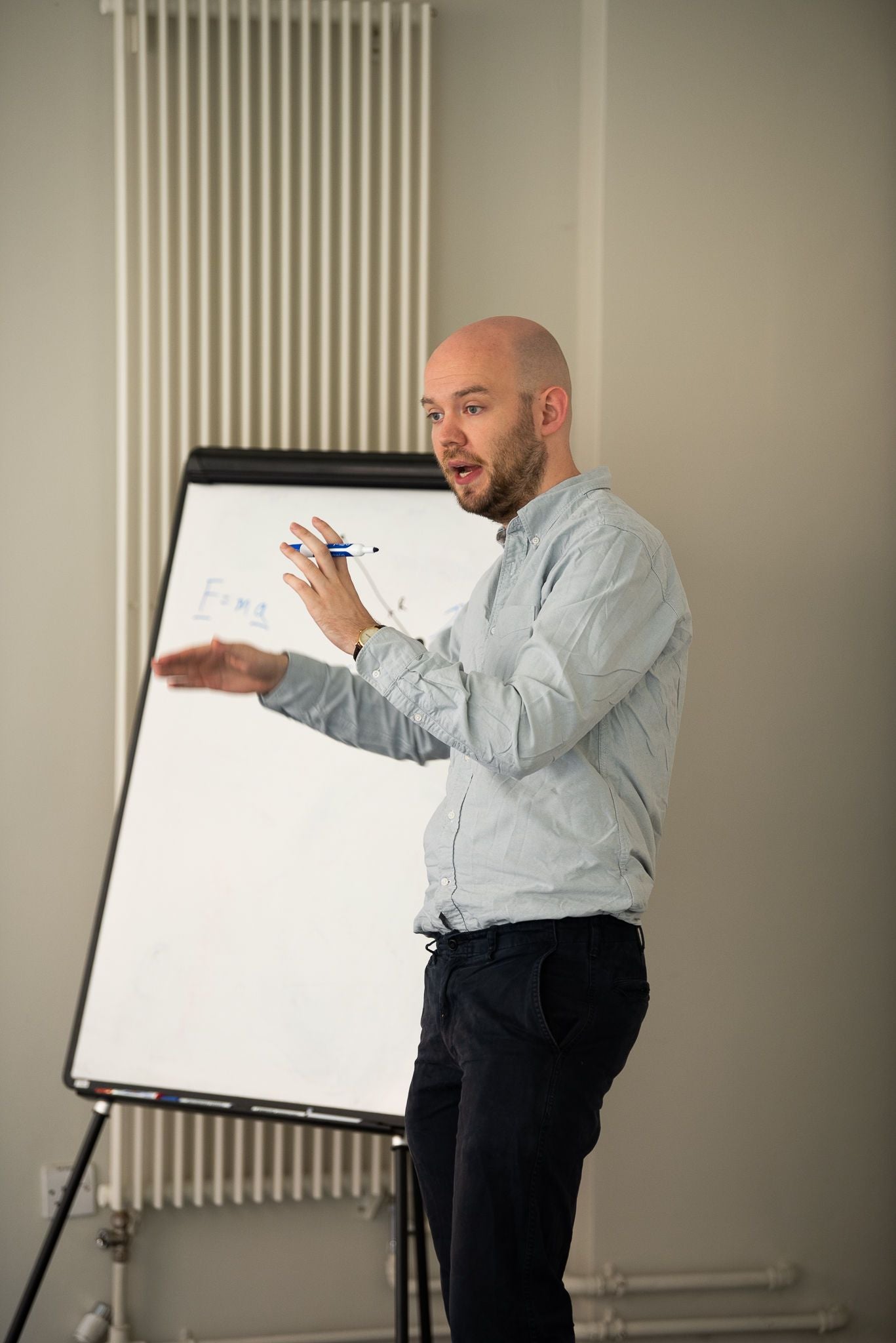 Teacher Standing in front of a whiteboard