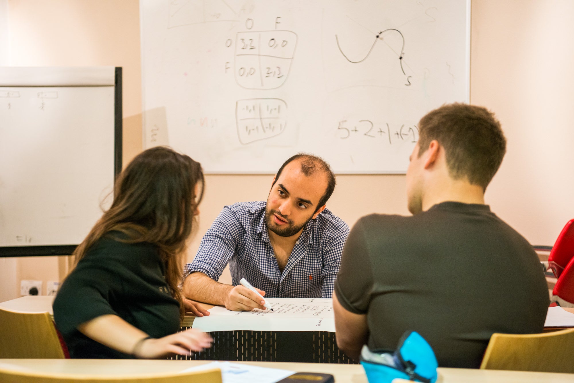 A tutor interviews two Oxford or Cambridge University applicants