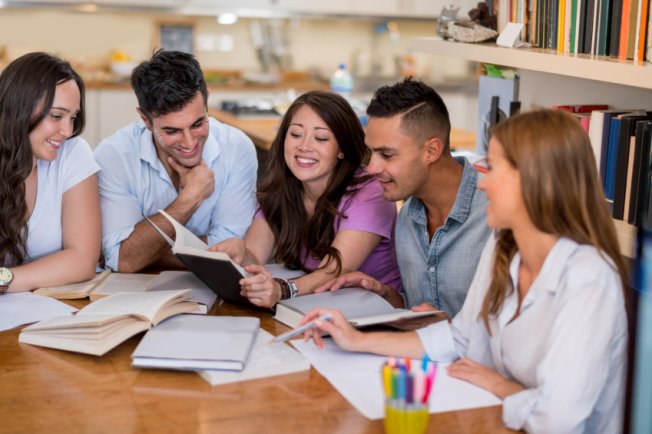 International students revising for university exams with friends