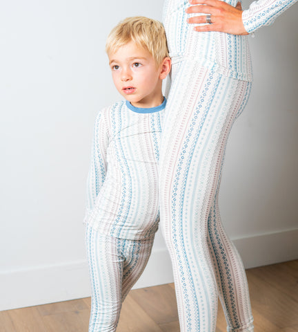 child in white and stripe pajamas