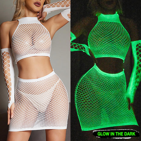 A close-up image of a woman wearing a Sexy Glowing Fishnet Bodysuit Tights. The fishnet tights are intricately woven and glow in the dark, adding a unique and alluring element to the lingerie. The bodysuit is form-fitting and accentuates the curves of the woman's body. She stands confidently, with her hands on her hips, and looks directly at the camera.