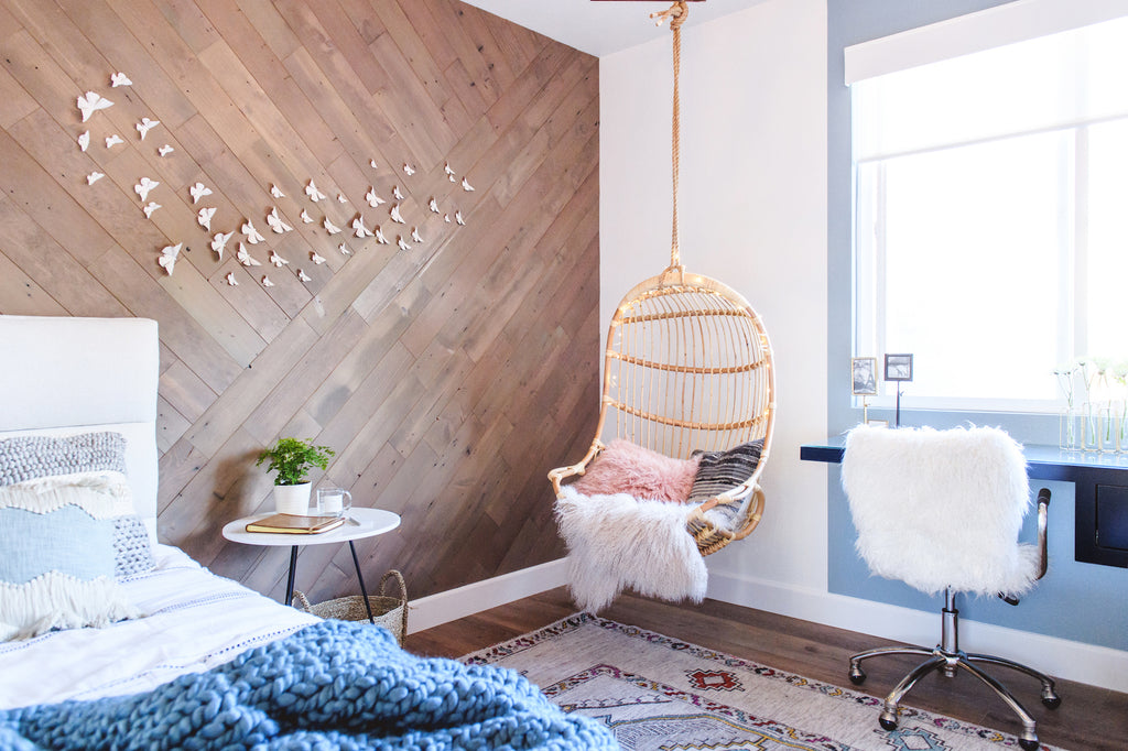 A geometric wall pattern made with wood wall planks gives this little girls room a beautiful focal point. 
