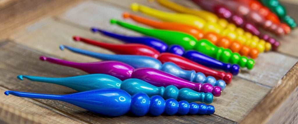 CANDY SHOP CROCHET HOOKS LAY IN A WOOD TRAY