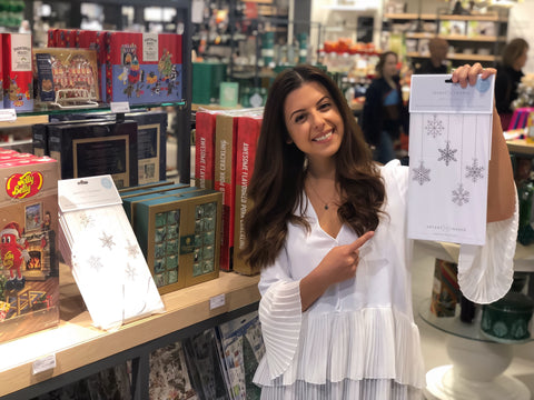 Kristina holding the Advent of Change advent calendar