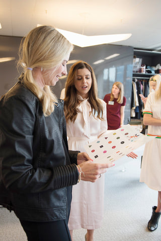 holly and kristina discussing the braille advent calendar