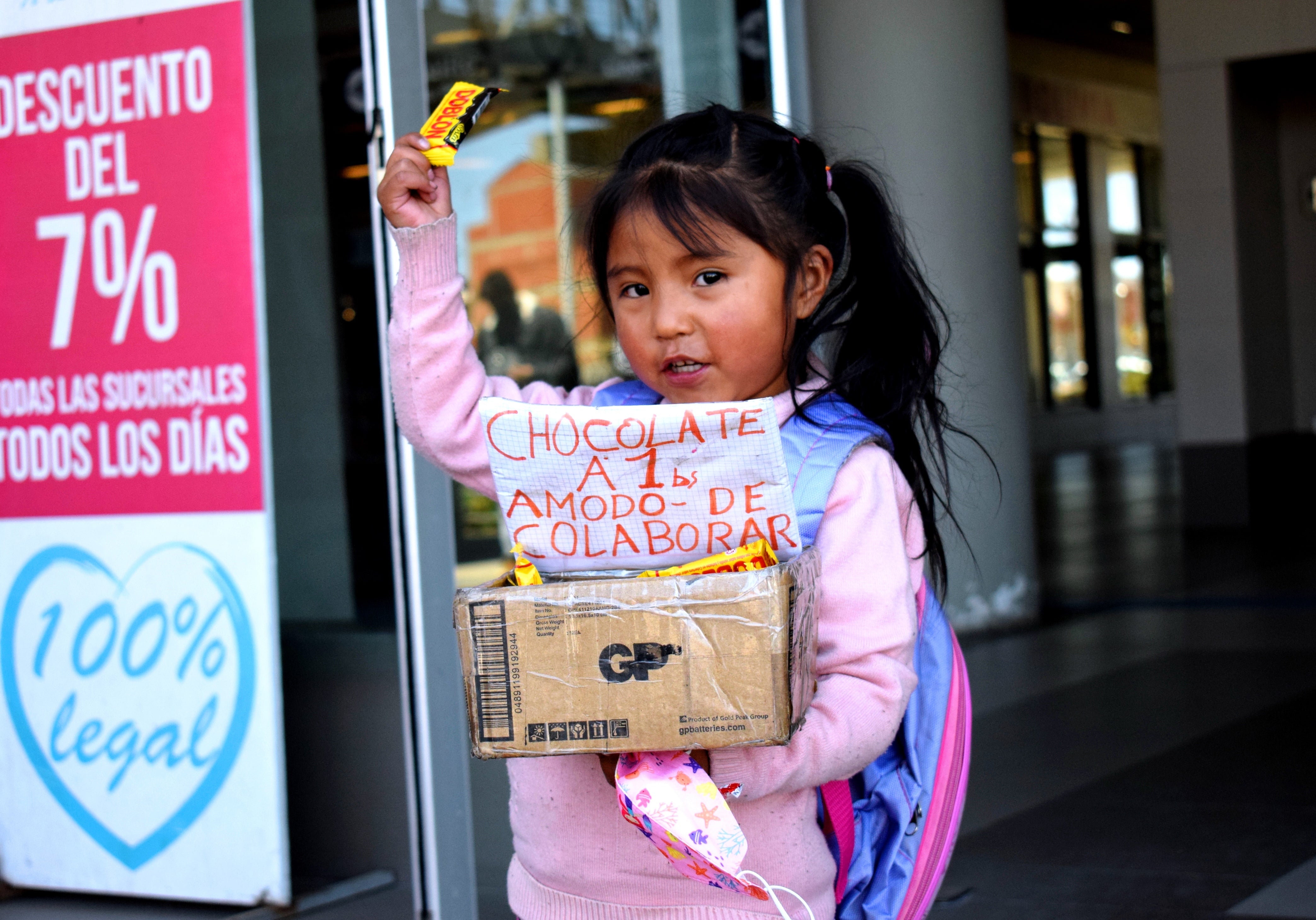 Girl selling chocolate on the street