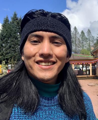 Member of the Navajo Nation, Cassius Johnson smiles at the camera