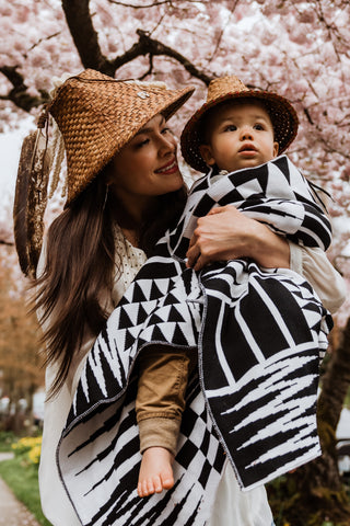 Coast Salish Baby Blanket in black and white features geometric patterns that mimic traditional Coast Salish weaving designs