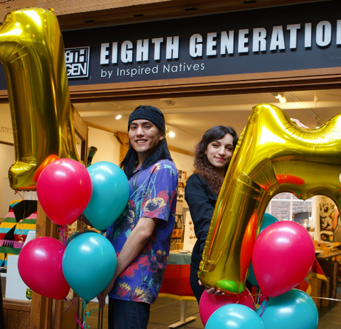 Cassius and Mayah hold blue and pink balloons to celebrate 1 million views on TikTok