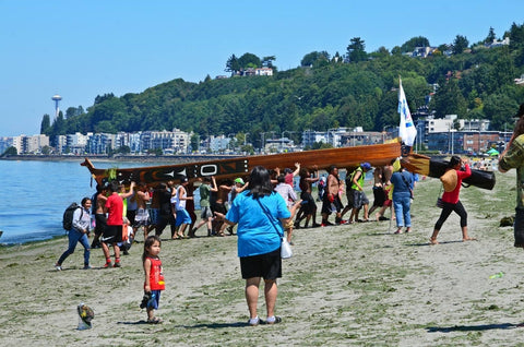 Canoes line a Puget Sound shoreline during the Power Paddle to Puyallup 2018. Photo courtesy of Chris Stearns (Navajo)
