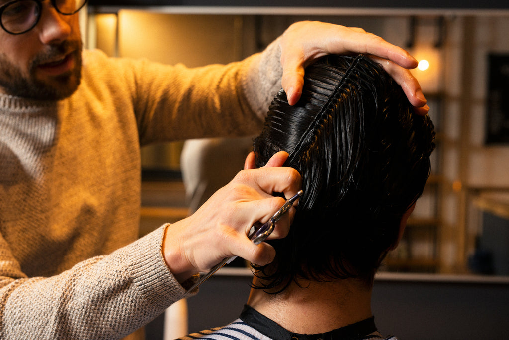 Wet hair being combed by Craig Boa at Weekly