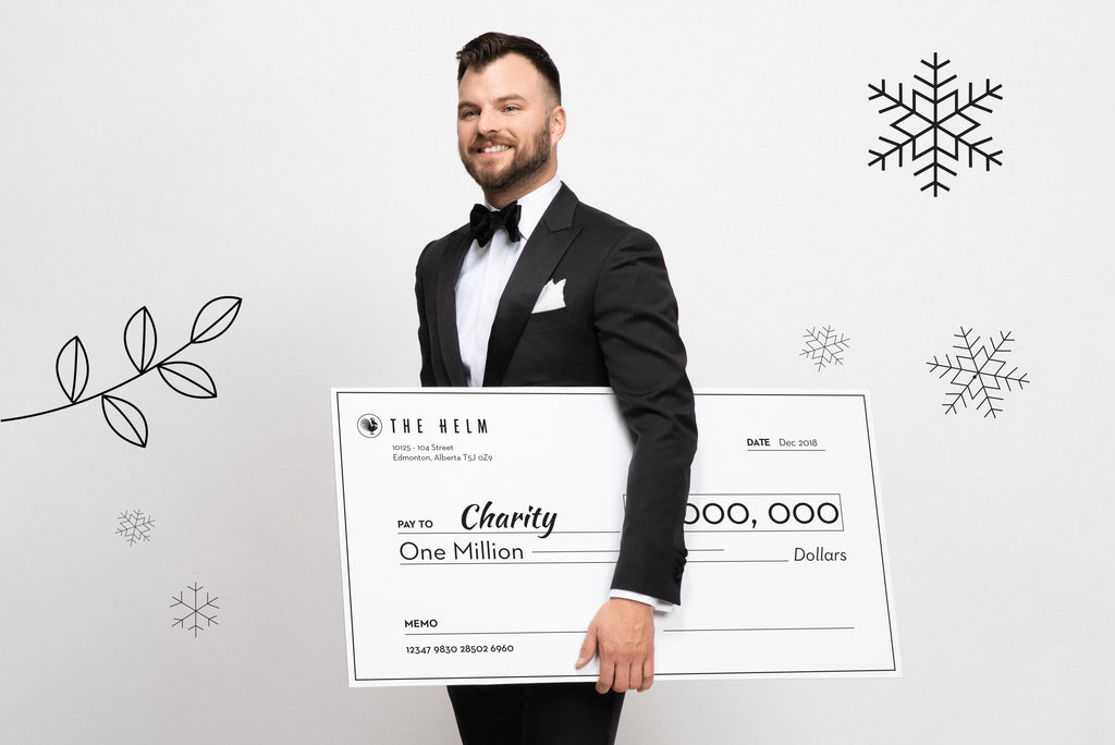 Formal gala outfit: Black tuxedo with a cheque for charity