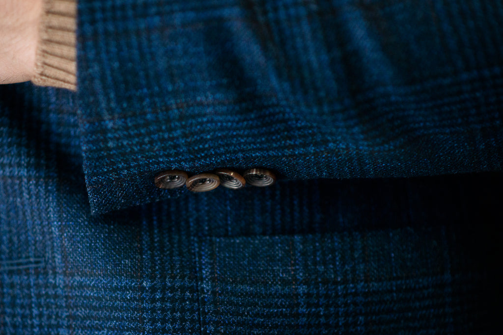 Sleeve fabric closeup of helm collection blue check sport jacket