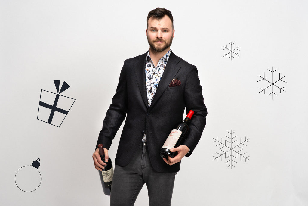 Dinner party outfit: Navy sport jacket, open collar floral shirt, grey jeans and two bottles of nice wine
