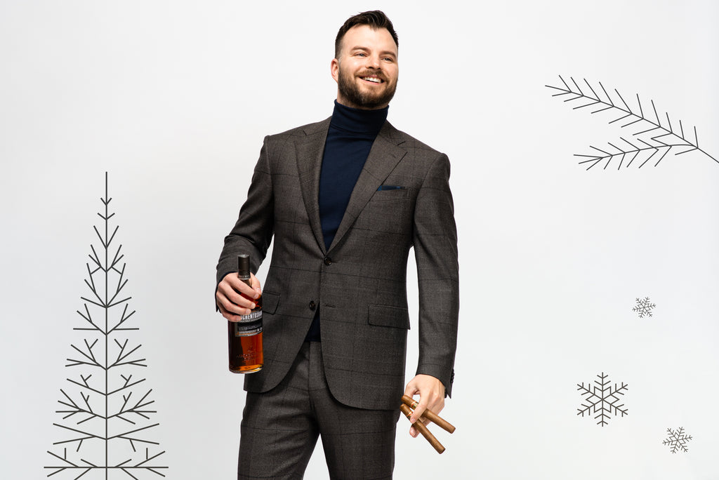 Office party outfit: Grey suit with navy roll neck sweater, two cigars and a bottle of scotch