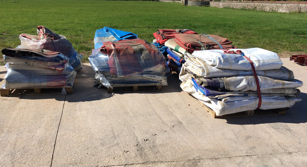 Lorry curtains on euro pallets, fastened down by ratchet straps