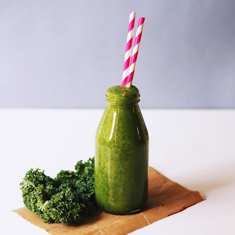 Green CBD smoothie with two straws