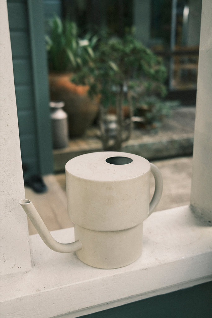 Our friend gave us this watering can and remarked how it looked like a silo. It really does. We use it daily.