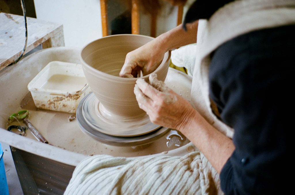 Nesting bowls are one of those Potters challenges - like the tea pot. They are made of multiple pieces that all have to fit together seamlessly in order to function well. Needless to say, making simple round nesting bowls wasn’t enough of a challenge and I had to add spouts onto each of the bowls as well! I have been making stacks of 5, although am pretty sure I could stack at least a set of 8 by now. I use a blend of Stoneware clays which go through three kiln firings to achieve the beautiful turquoise and copper textures on the outside. The biggest challenge is keeping the bowls from warping. Any time you pick up or move a bowl or if they dry unevenly you risk deforming the shape which means that a whole set won’t stack. Often these faults don’t appear until the very last firing , so it’s always a sigh of relief when they come out well.