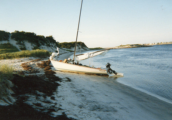 An old photo of me in a boat - one of the sailing trips I used to take with my dad.