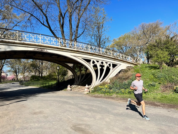 Stefan running under a bridge in Central Park.