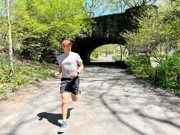 Stefan running under a bridge in Central Park.