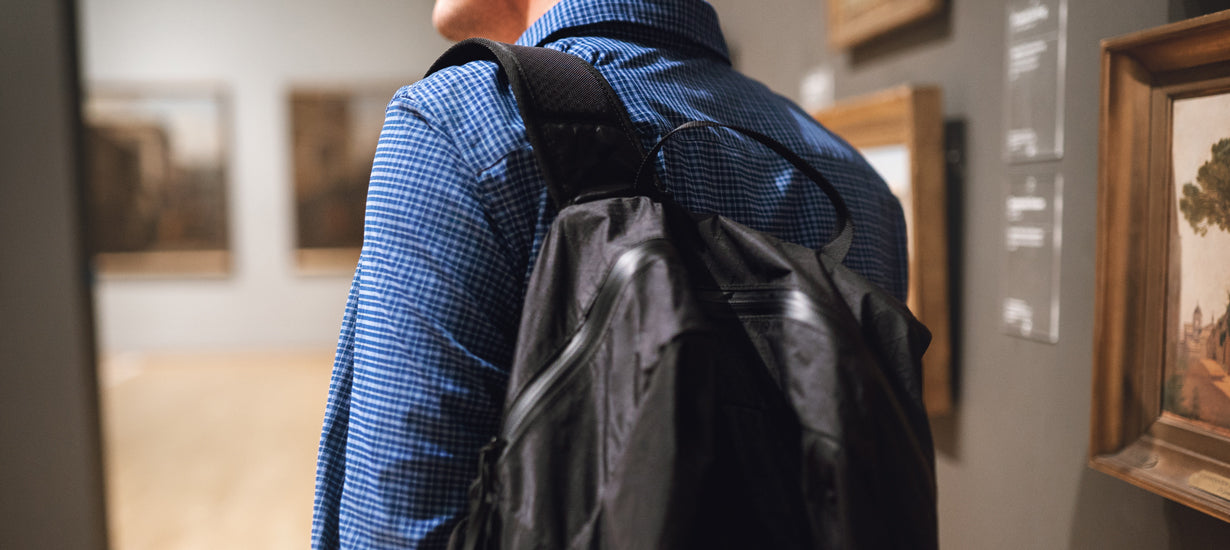 A man wearing a travel backpack.