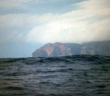 Seaside cliffs in the distance.