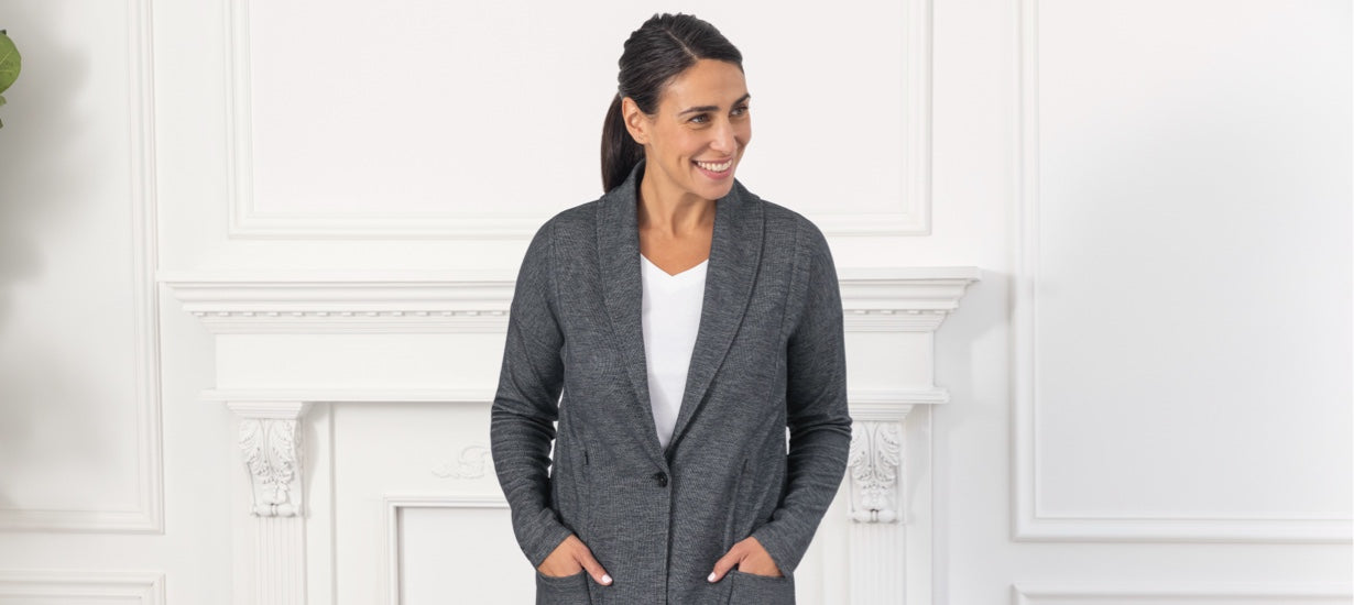 Model with arms on hips wearing the Como Cardigan Blazer in charcoal.