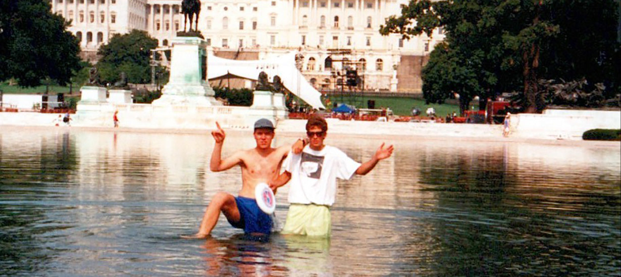 Old photo of two men swimming in a fountain in Washington, D.C.