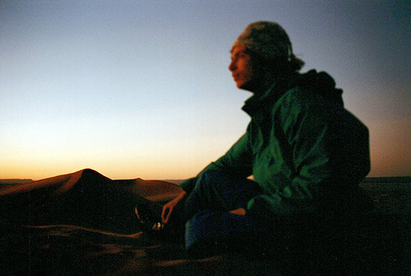 Stefan watching the sunrise over dunes in Morocco 20 years ago.
