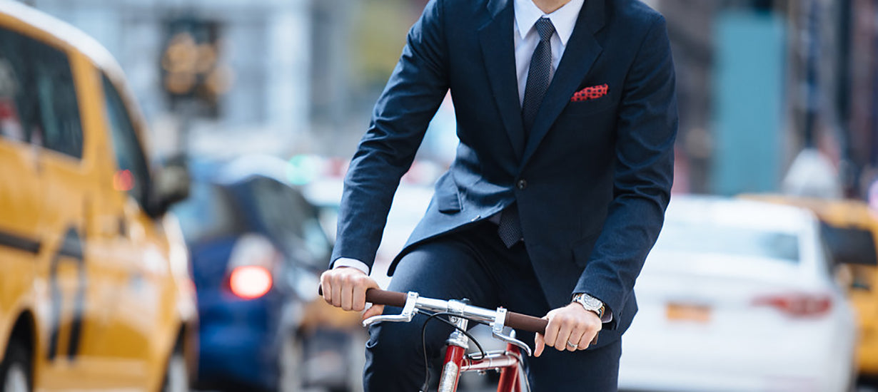 Riding a bike while wearing the Gramercy Suit