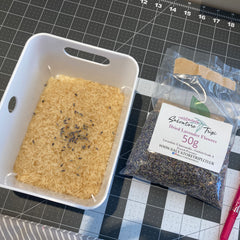 Picture of rice in a white bin and lavendar flowers in a bag