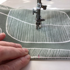 Sewing fabric on a sewing machine