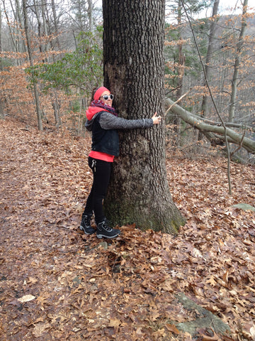 Alex Lozier hugging a tree