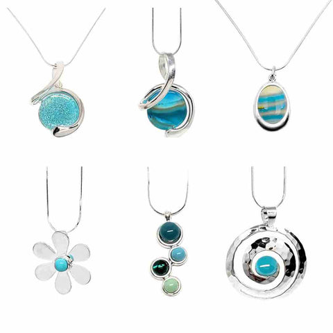 A collection of six blue-hued fused glass and silver setting necklaces by Glass Elements