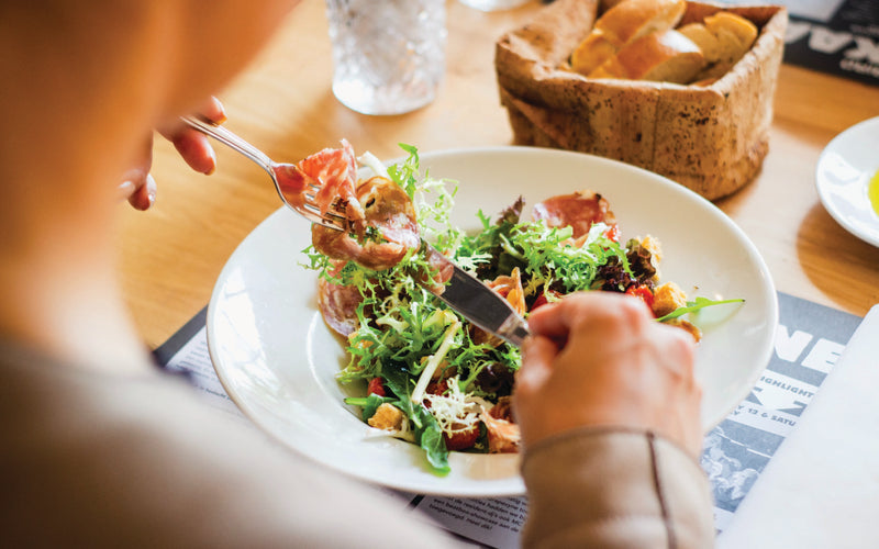 person eating a salad