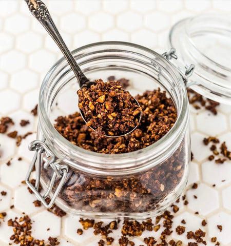 Chocolate granola in a glass container
