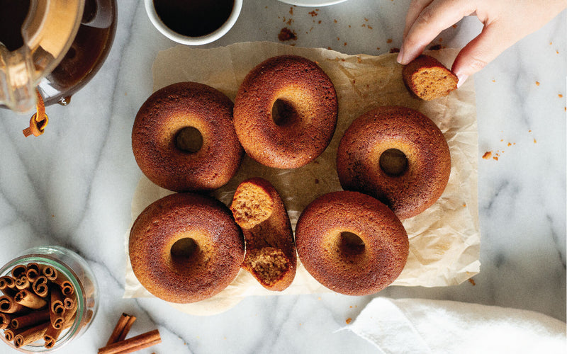 Keto cinnamon donut on board with coffee