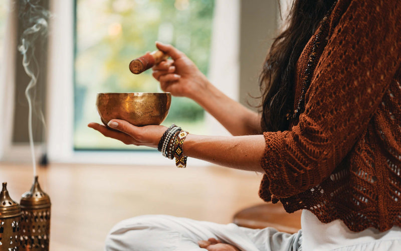 Person holding meditation bowl