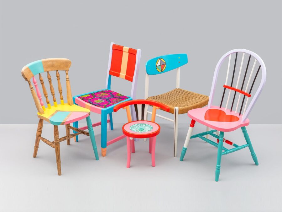 Photo of a group of colorful chairs designed by Yinka Ilori