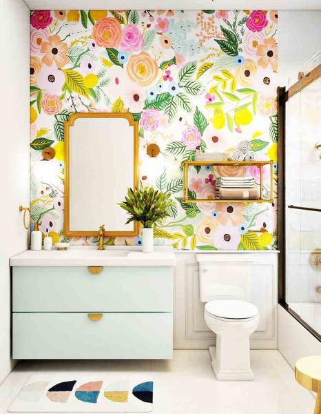 Photo of a bathroom with a bright floral wallpaper.