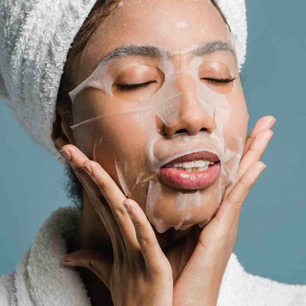 Black woman wearing a skin care face mask.