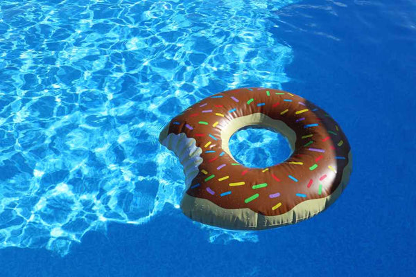 Swimming pool water with donut inflatable.