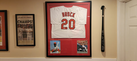 Cardinals baseball jersey, Brock and autographed baseball bat.