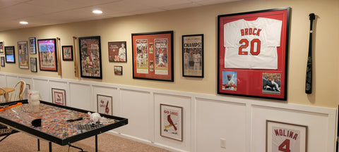 Ryan's St. Louis Cardinals baseball sports room setup with memorabilias from stadiums.