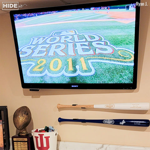World Series MLB bats displayed in an HBat in his Cardinals room.